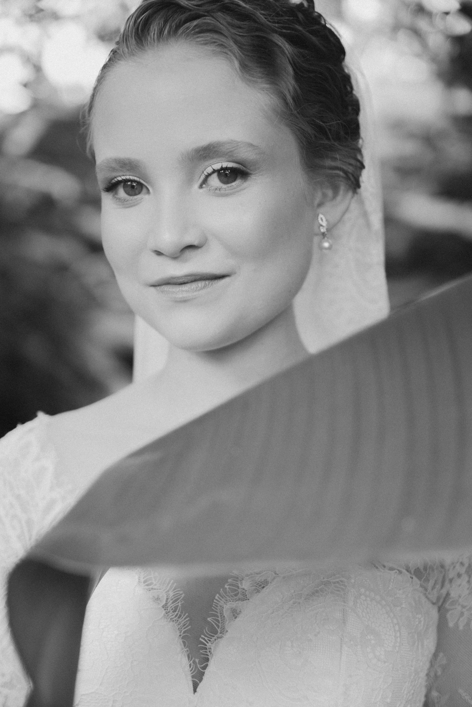 Classic black and white bridal portrait with delicate lace details.