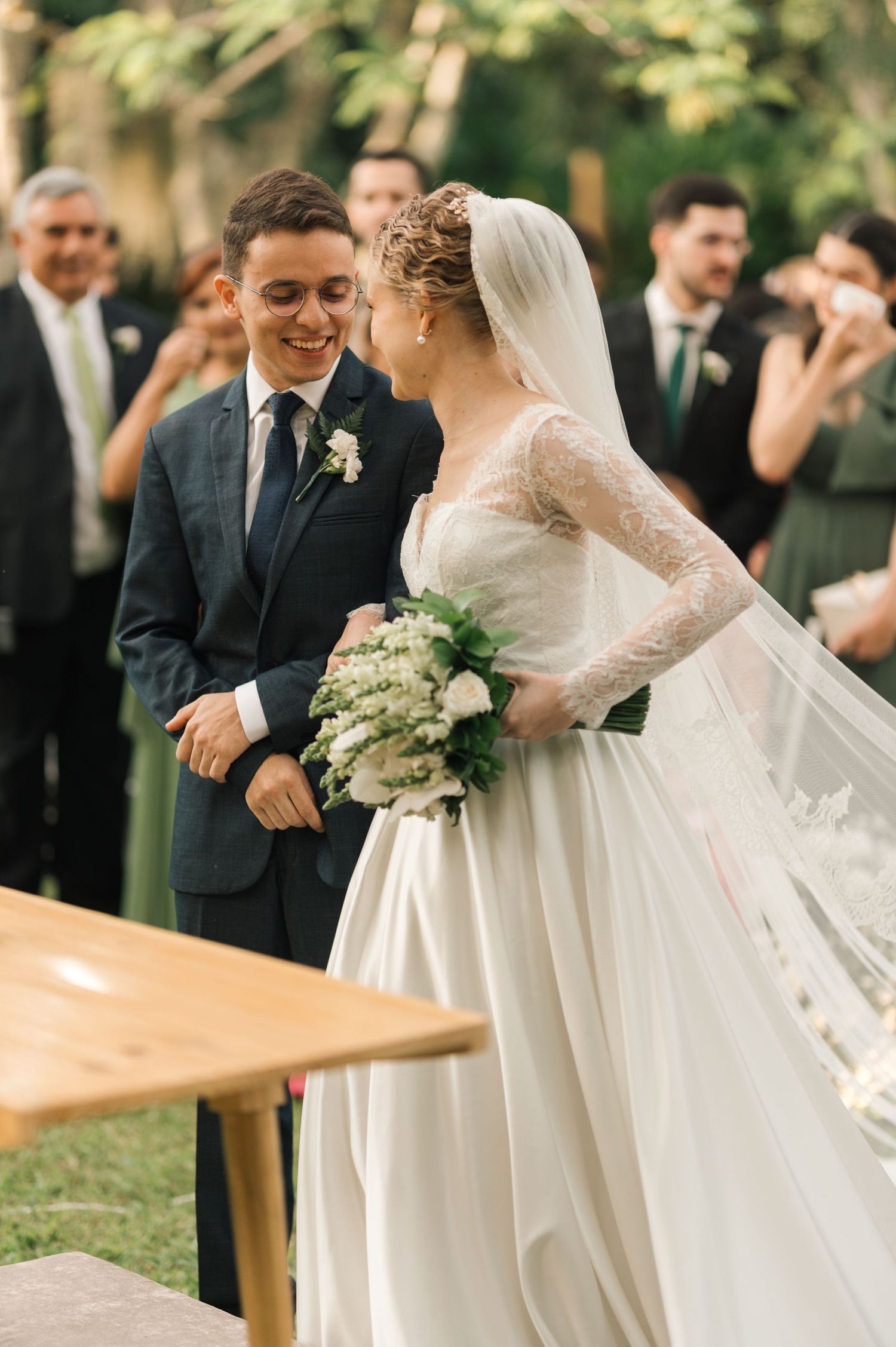 Happy couple sharing a moment during their garden wedding ceremony.