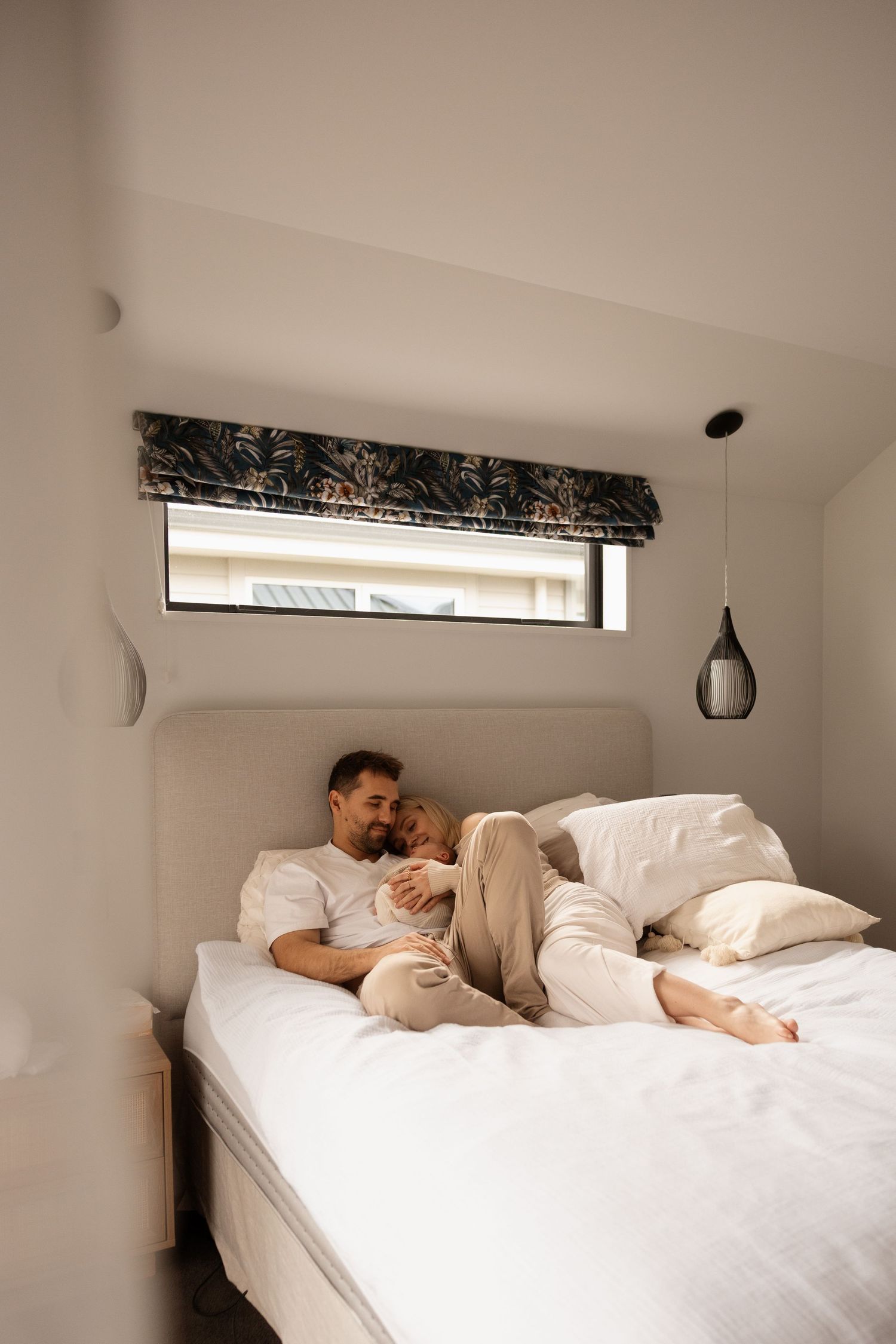 In home newborn family session, natural and timeless, parents cuddling newborn in christchurch