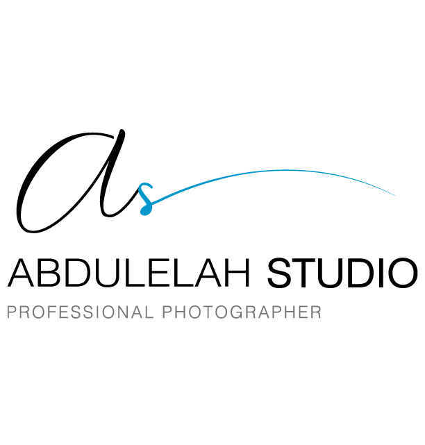 Professional photography logo design featuring handwritten signature and blue dot accent for Abdullah Studio.