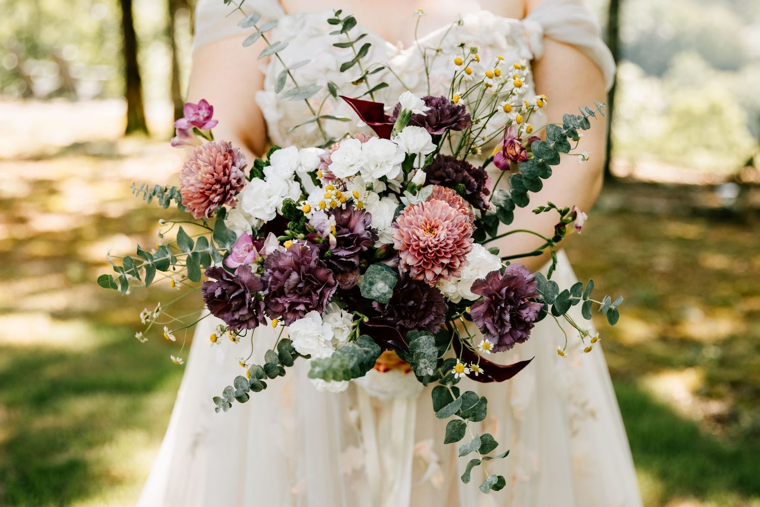 A brides bouquet for their whimsical elopement bridal portraits at Rocky Top Falls in Fairfield Bay, Arkansas.