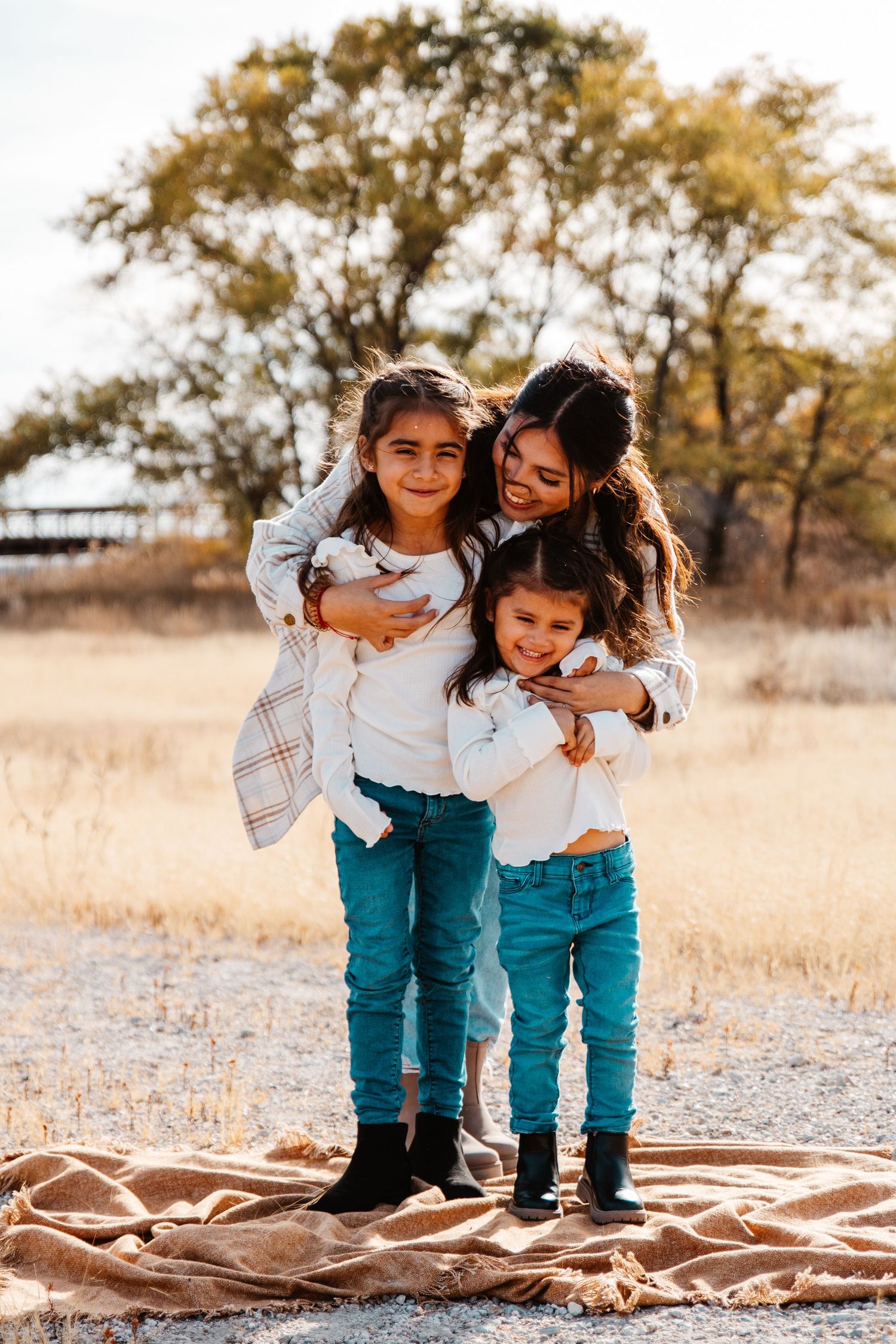 Young boy smiles into camera during Fall photo shoot in Kearney, NE