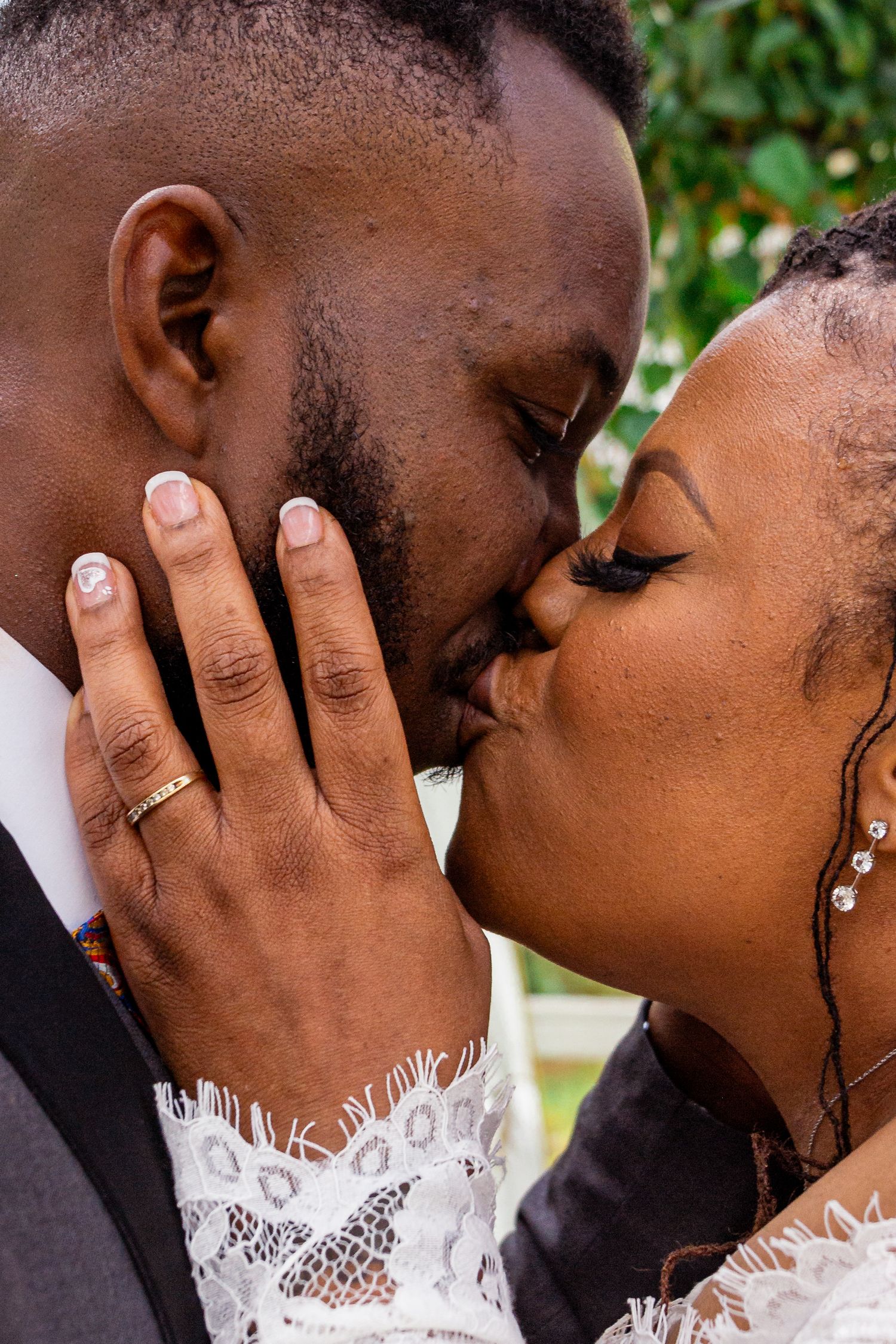A romantic outdoor wedding ceremony with the couple exchanging vows.