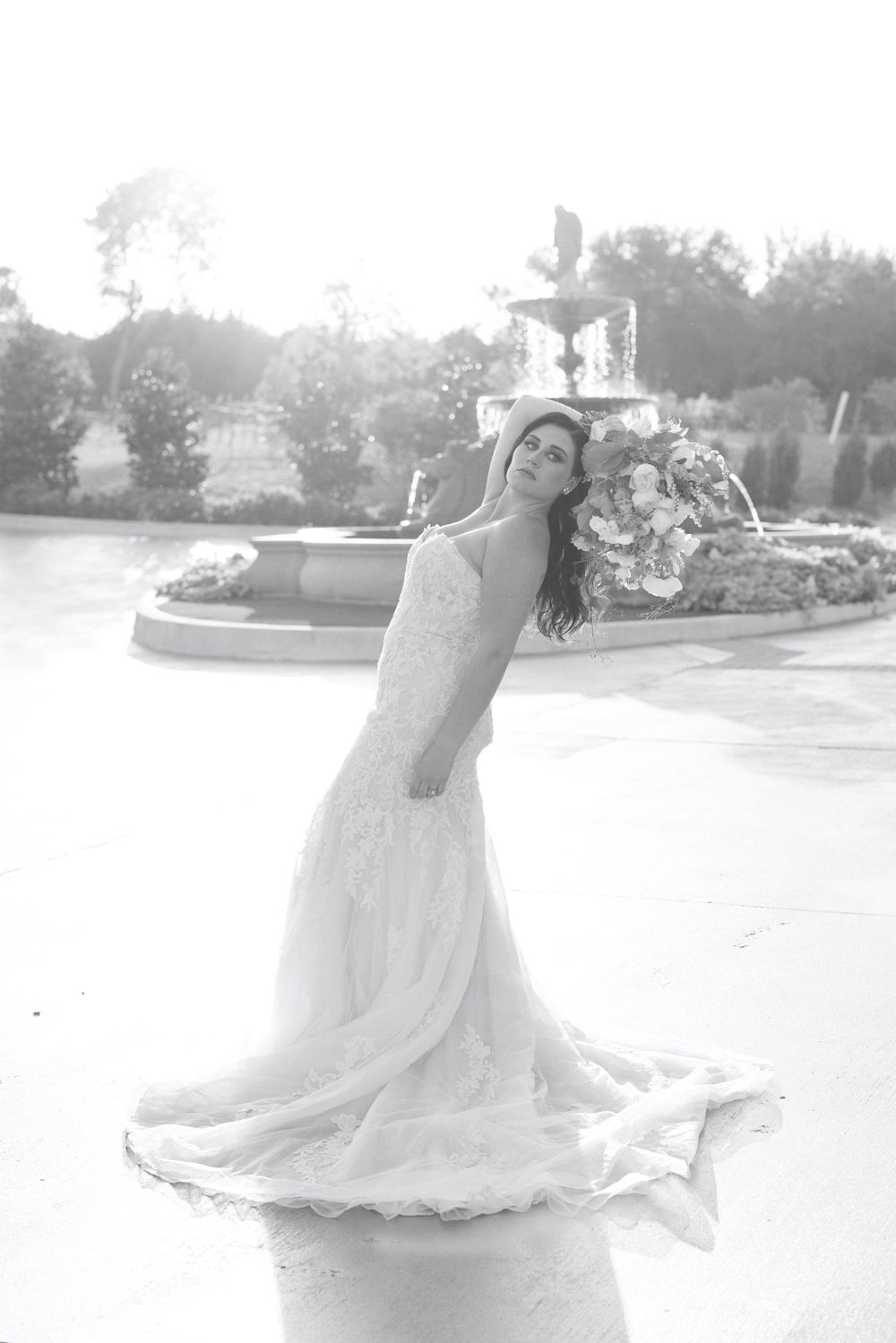 Dreamy overexposed bridal portraits showing movement and flow of wedding dress in natural light.