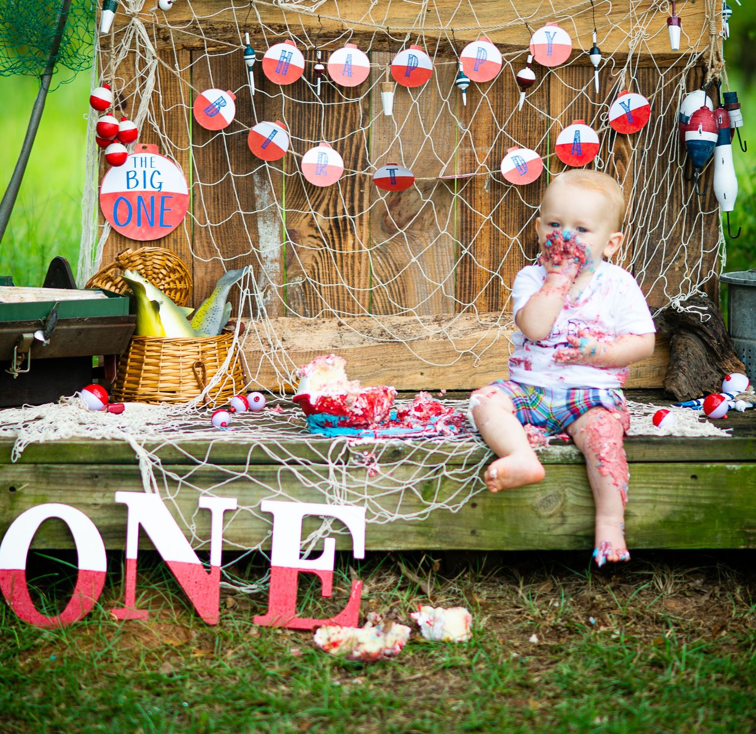 first birthday session creative set fishing smash cake outside natural light photo