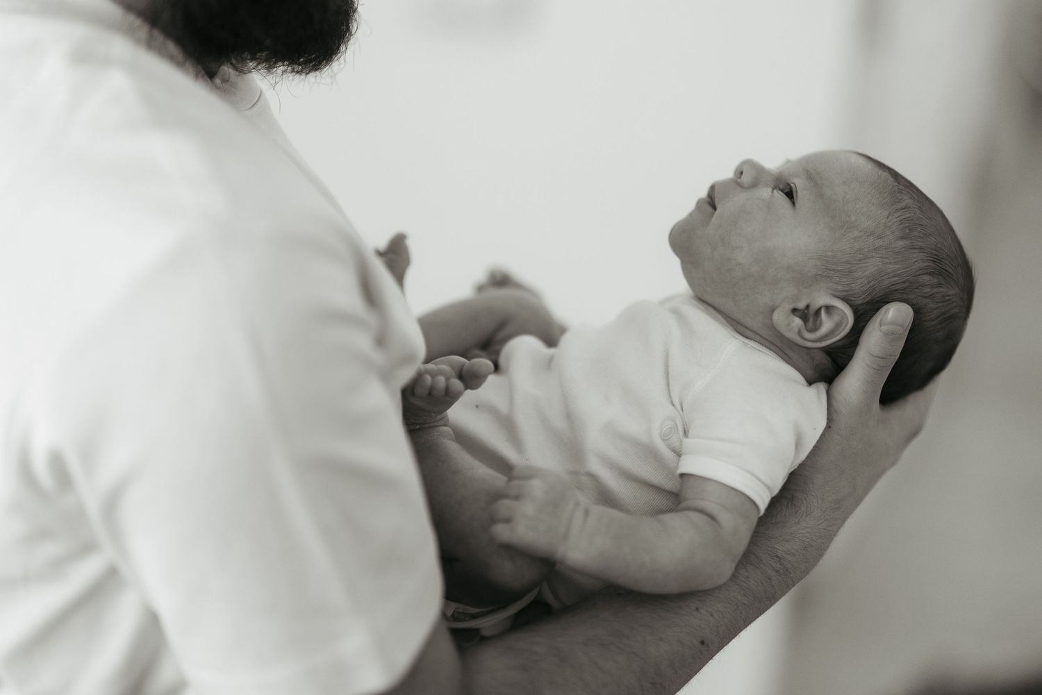 A touching black and white wedding moment showing a tender blessing during the ceremony.
