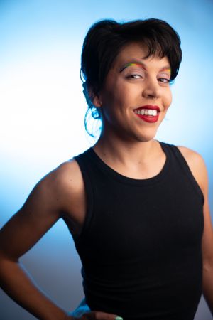 A dramatic portrait series with blue lighting showing joyful expressions.