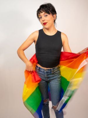 Fashion portraits featuring casual style and a rainbow pride flag against white backdrop.