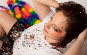 Creative fashion portraits with multicolored confetti and vibrant styling.