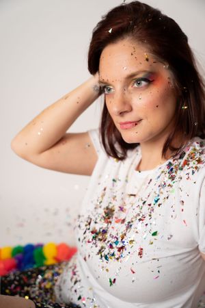 Studio portraits featuring rainbow accessories and confetti details.