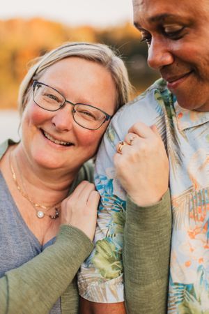 A couple shares joyful laughter together in a series of candid moments during a photo session.