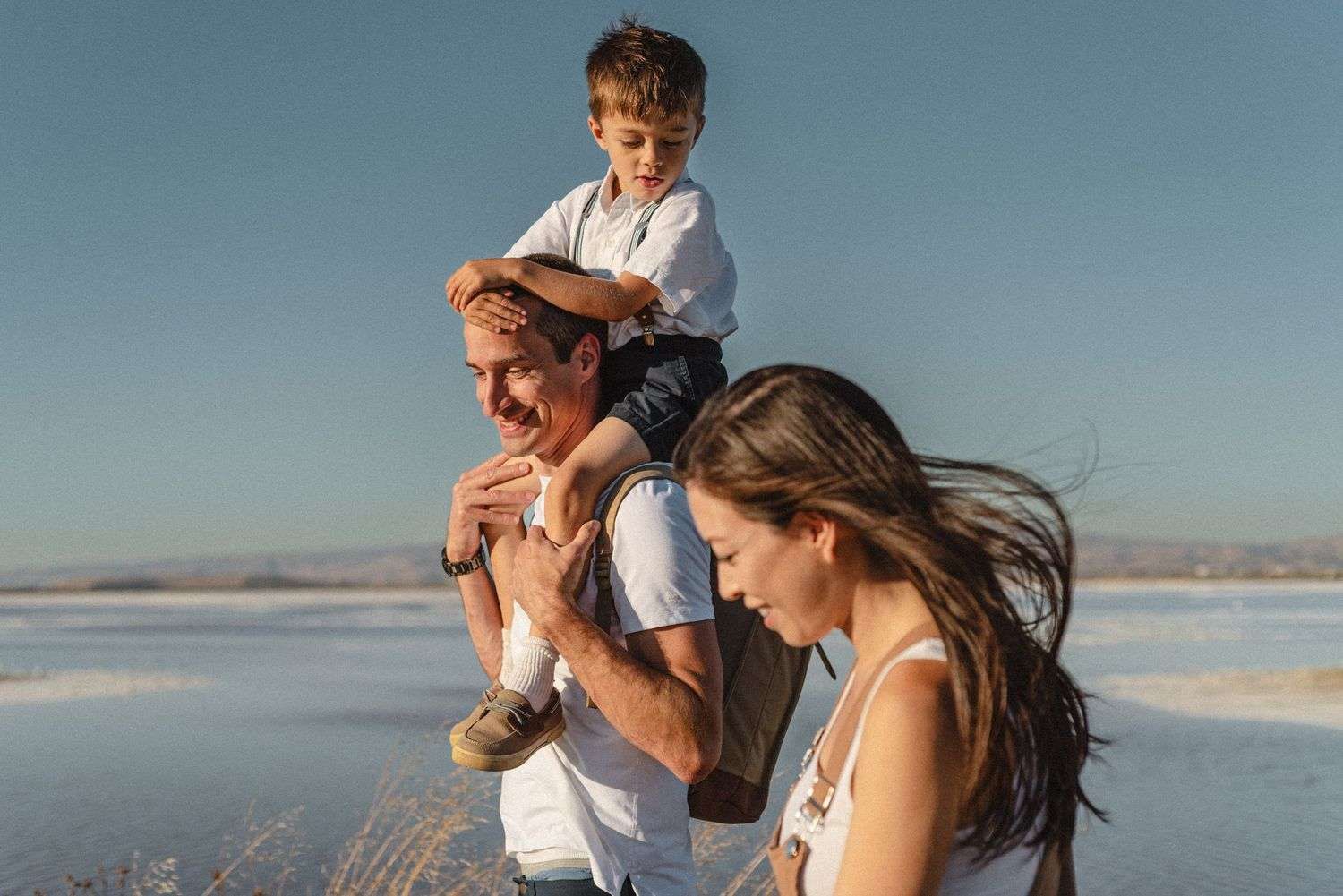 Family and photographer enjoying a relaxed walk near Fremont, CA as the sun sets over the San Francisco Bay.