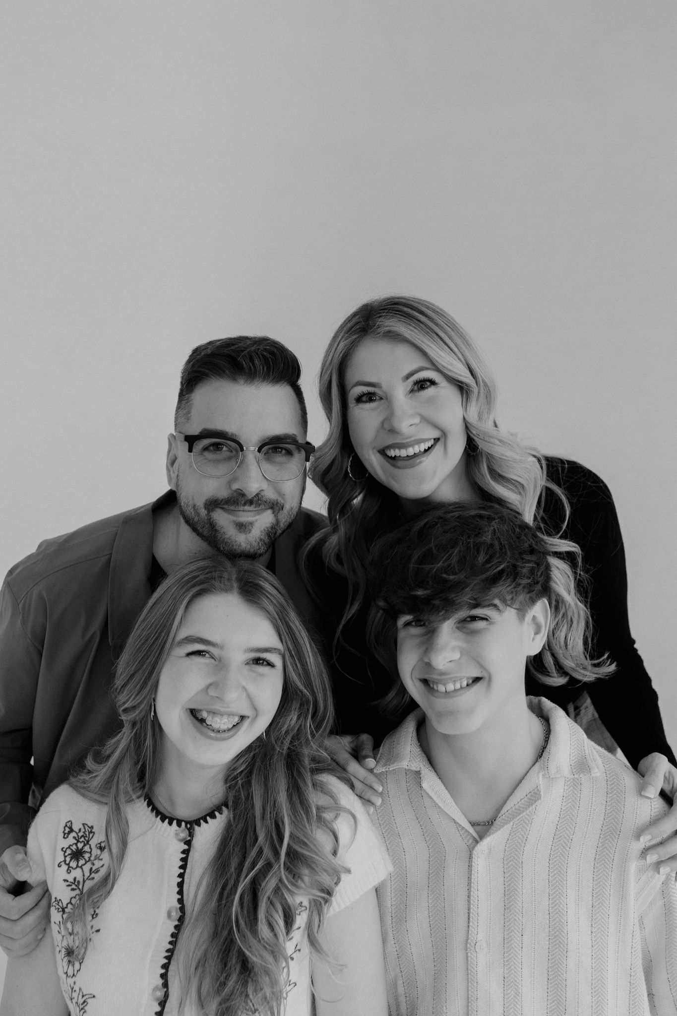 Group photo session against a light gray studio backdrop, Orlando FLORIDA