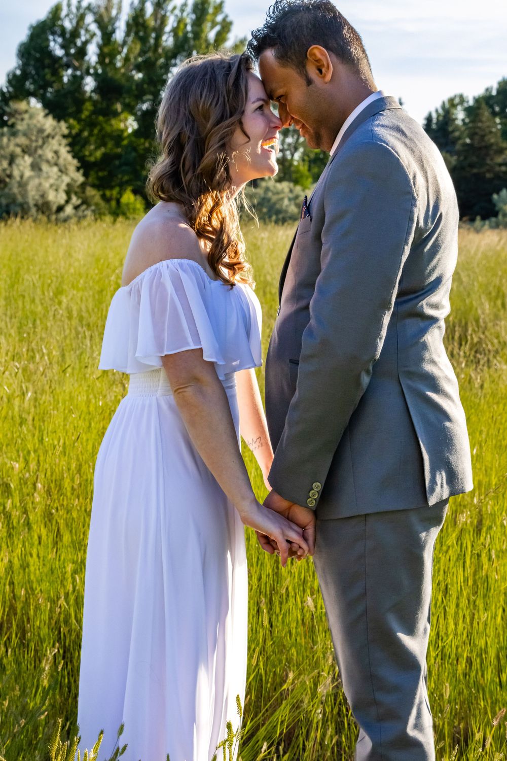 a couple together in a field.