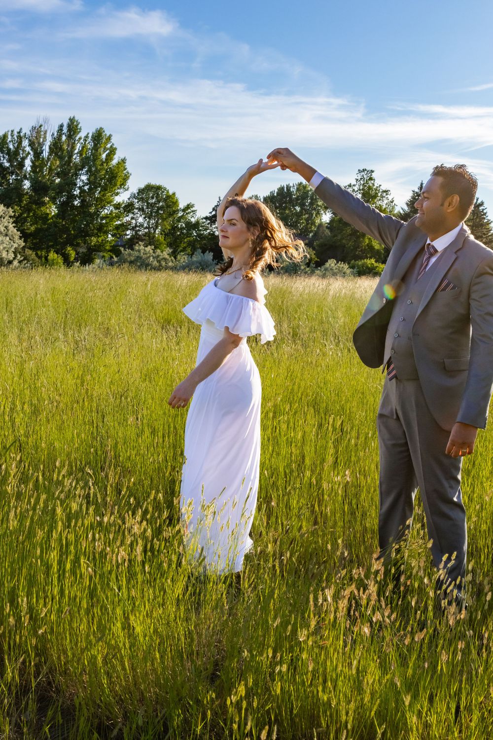 a couple together in a field.