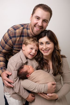 Heartwarming family portrait session showing playful interactions and warm embraces.