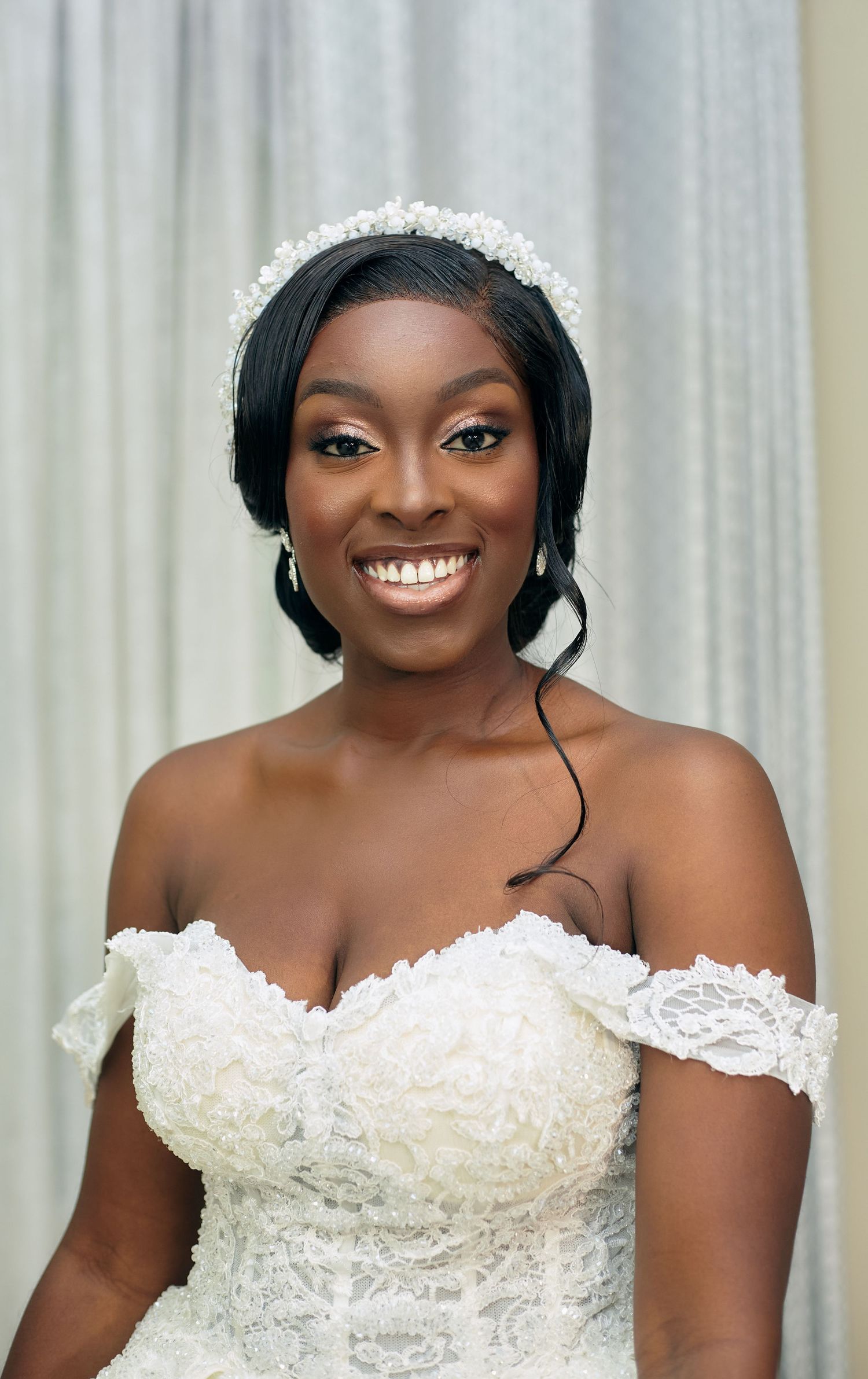 Close-up bridal portraits showcasing an elegant lace wedding dress and delicate tiara.