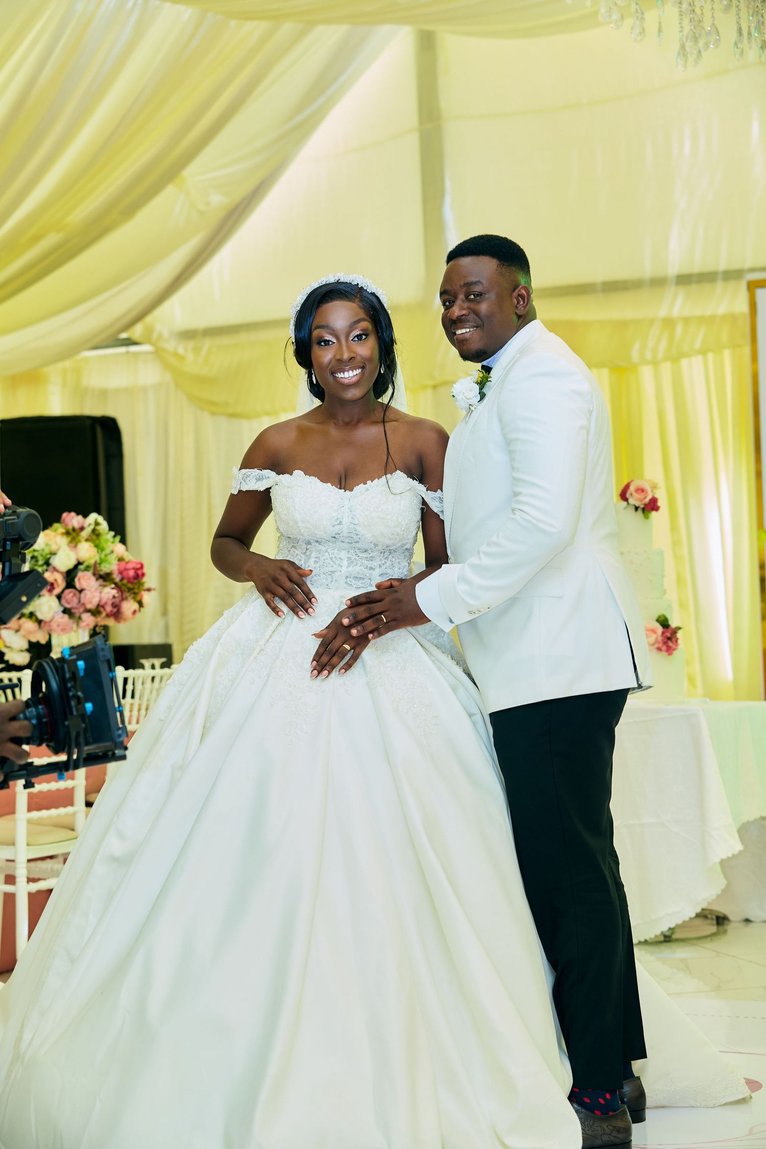 Couple shares romantic dance moment in elegant wedding attire.