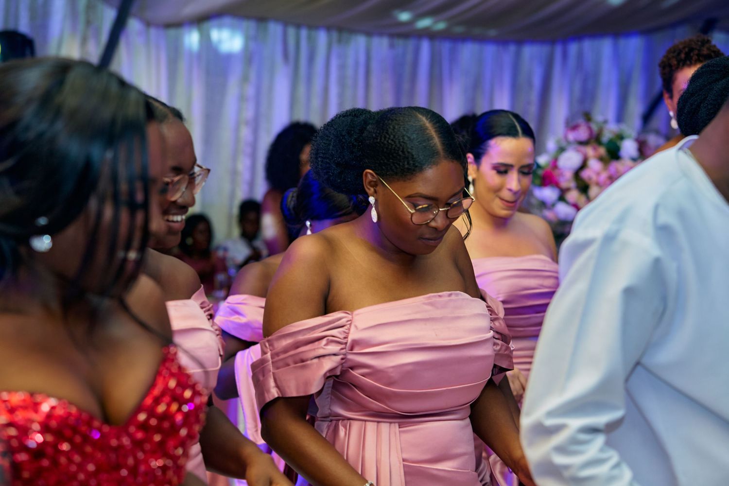 Wedding guests enjoying themselves during evening celebration.