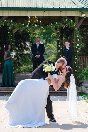 A sequence of wedding dance photos showing a couple performing a romantic dip move on an outdoor patio.