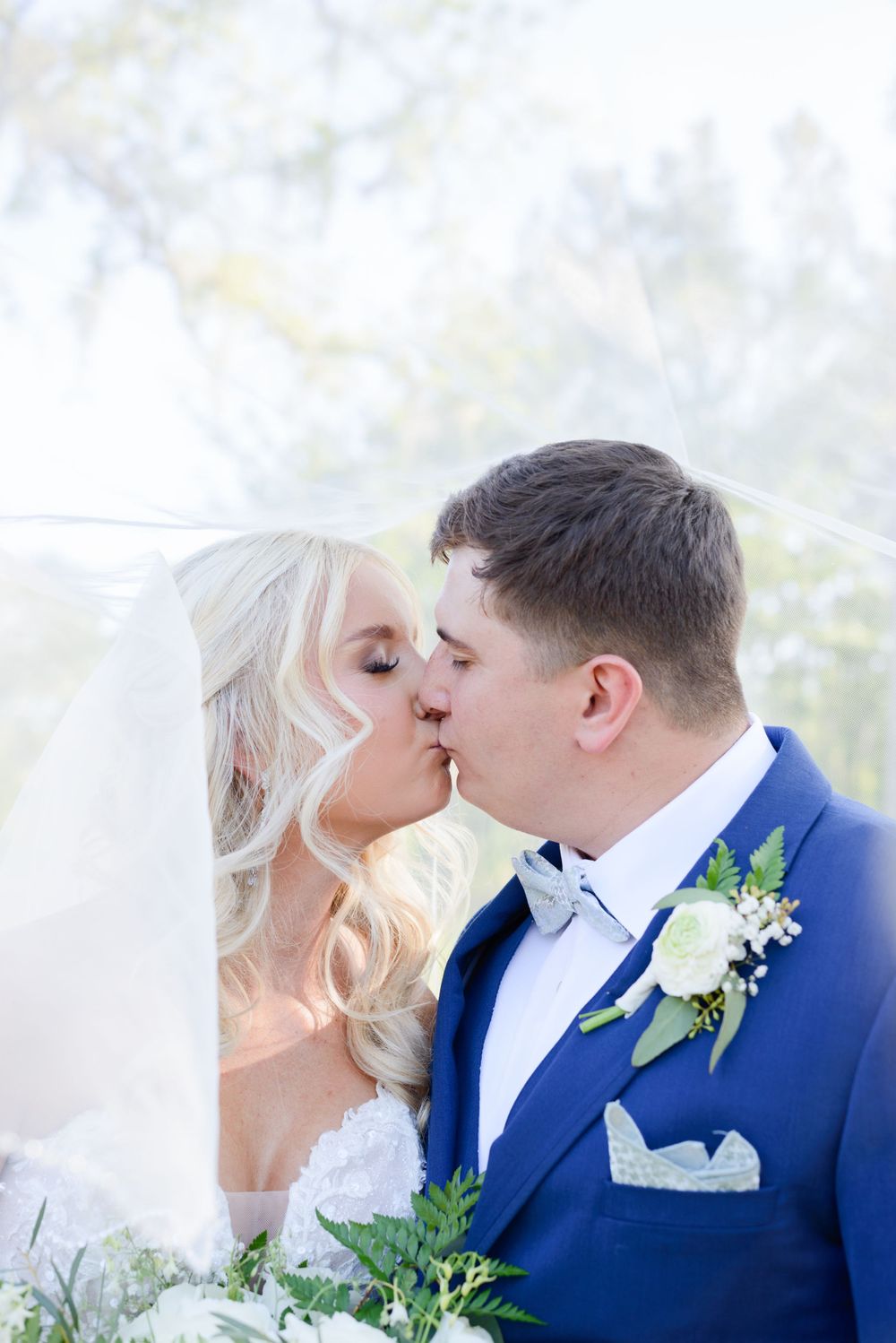 bride and groom kiss at wedding in live oak, florida at little red wagon