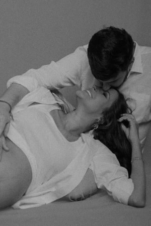 Black and white intimate couples maternity photos showing tender moments.