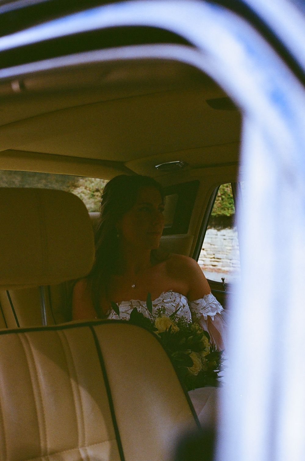 Interior view of a wedding car with soft focus and dreamy lighting.