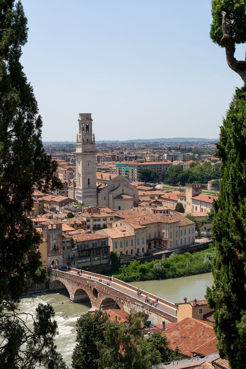 Historic cityscape of Verona, Italy with the Ponte Pietra bridge crossing the Adige River.