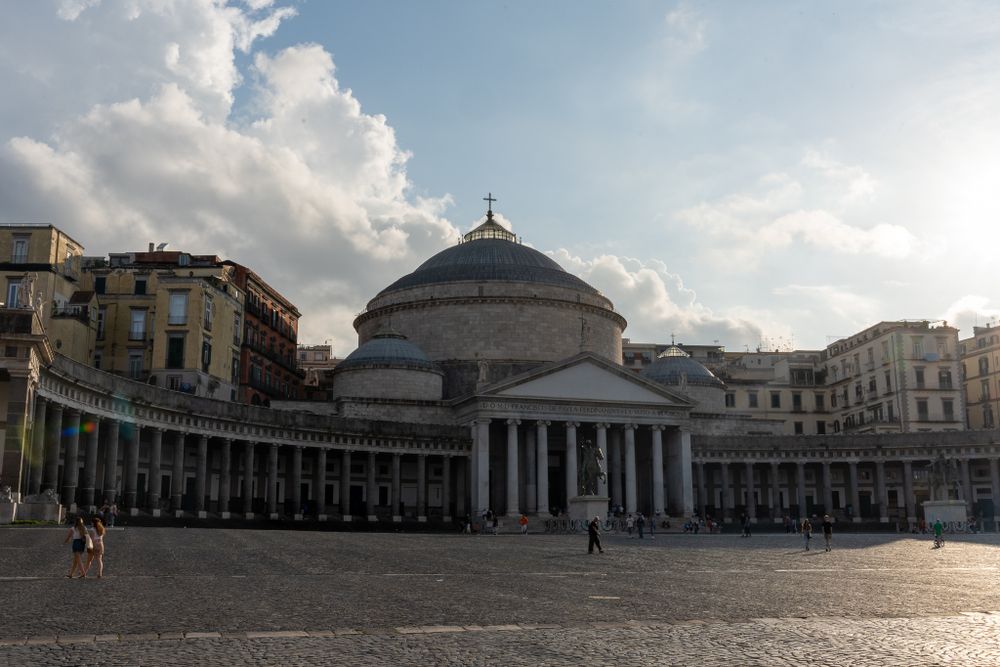 The historic Basilica di San Francesco di Paola with its neoclassical columns stands majestically in Piazza del Plebiscito, Naples.