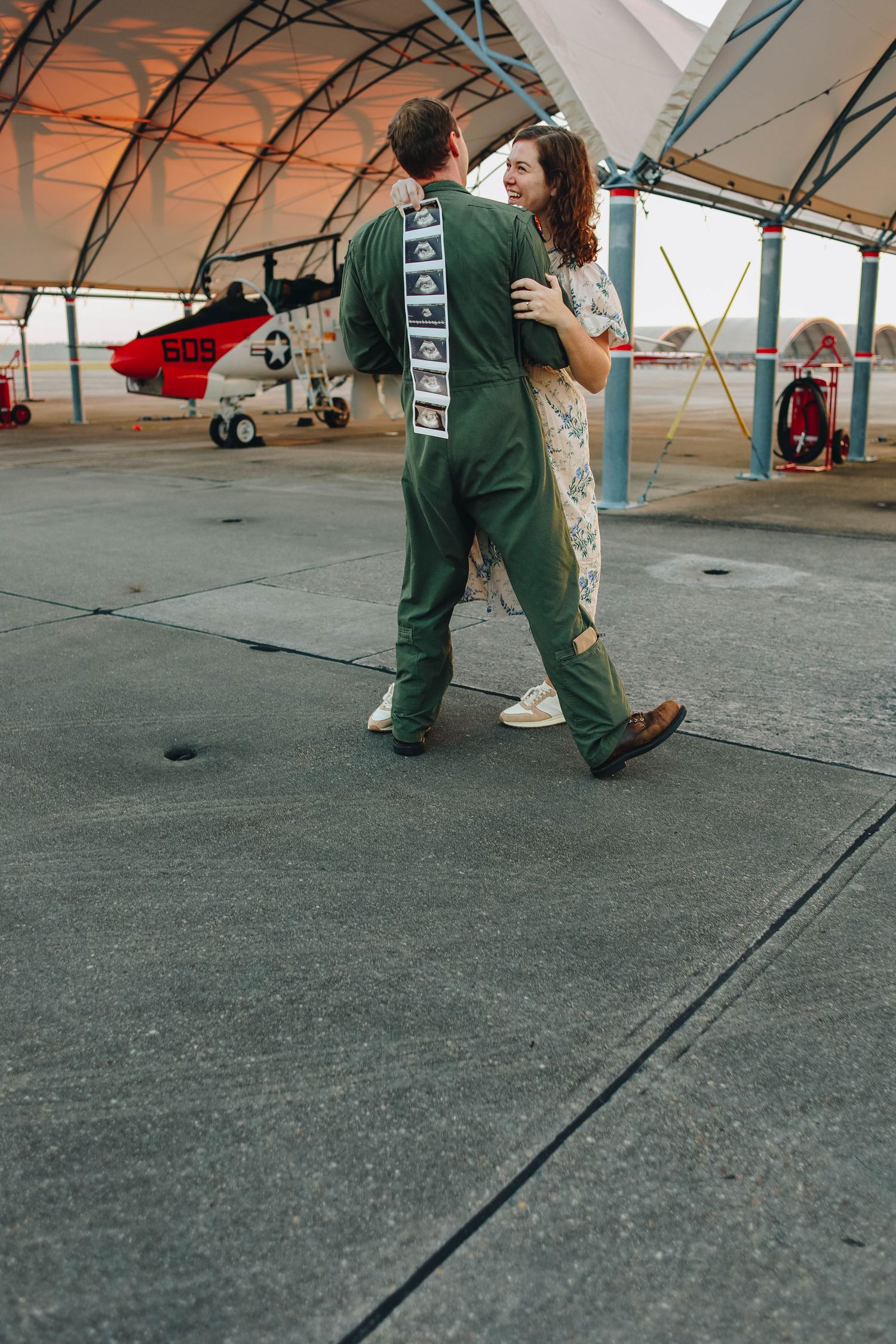 Pregnancy announcement at flightline Military base