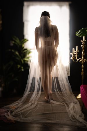 A bride shows poise and grace during her bridal boudoir session in Fort Worth, TX.