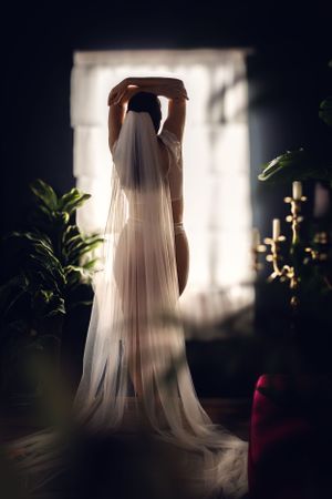 A bride shows poise and grace during her bridal boudoir session in Fort Worth, TX.
