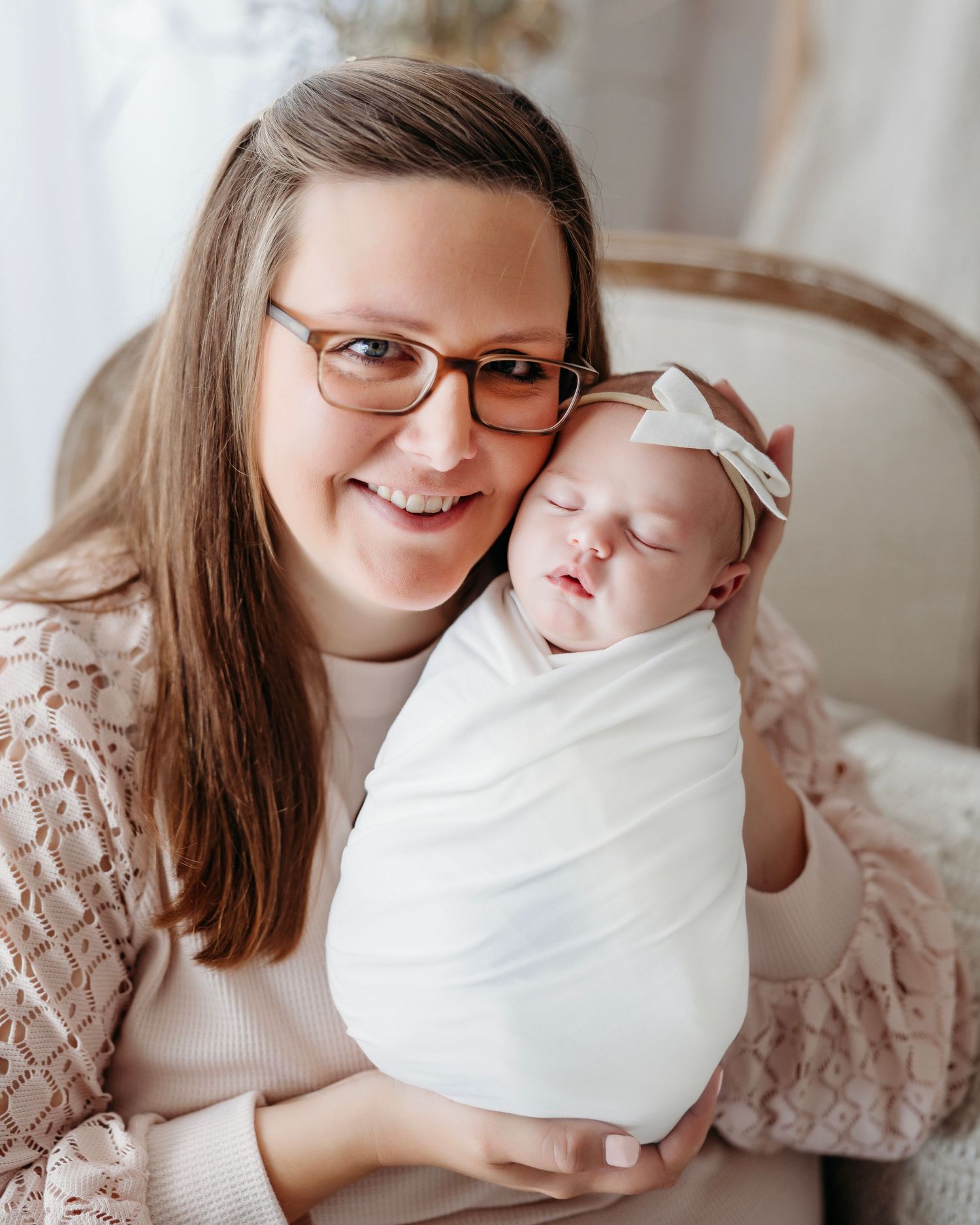 Mother and baby share tender moments in intimate portrait photographs with soft natural lighting.  Middle TN Newborn Photographer