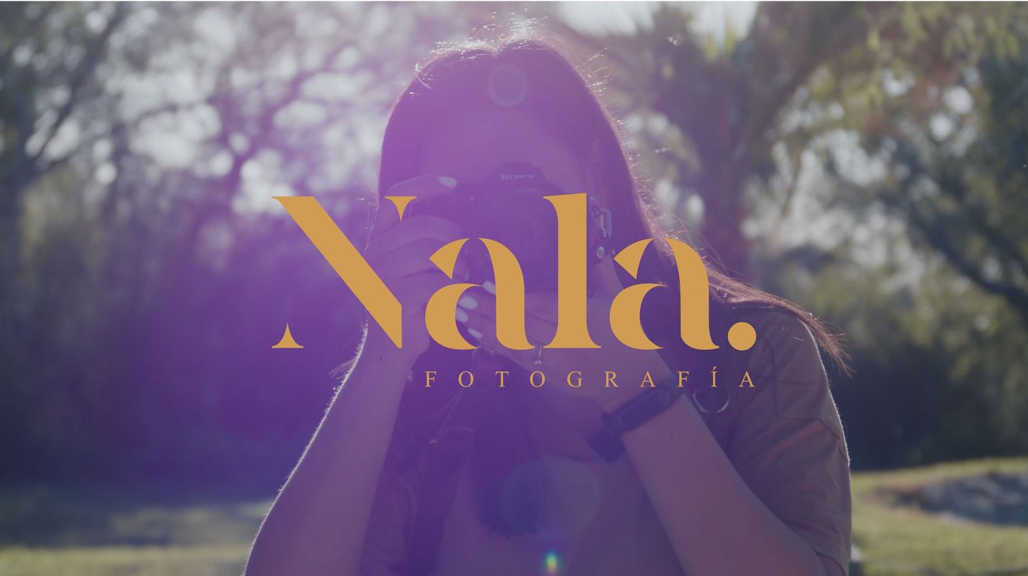 Purple-tinted photography logo design with artistic text treatment.