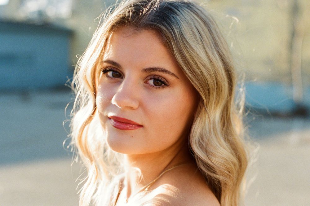 A series of profile portraits taken outdoors with warm golden sunlight creating a dreamy backlit effect.