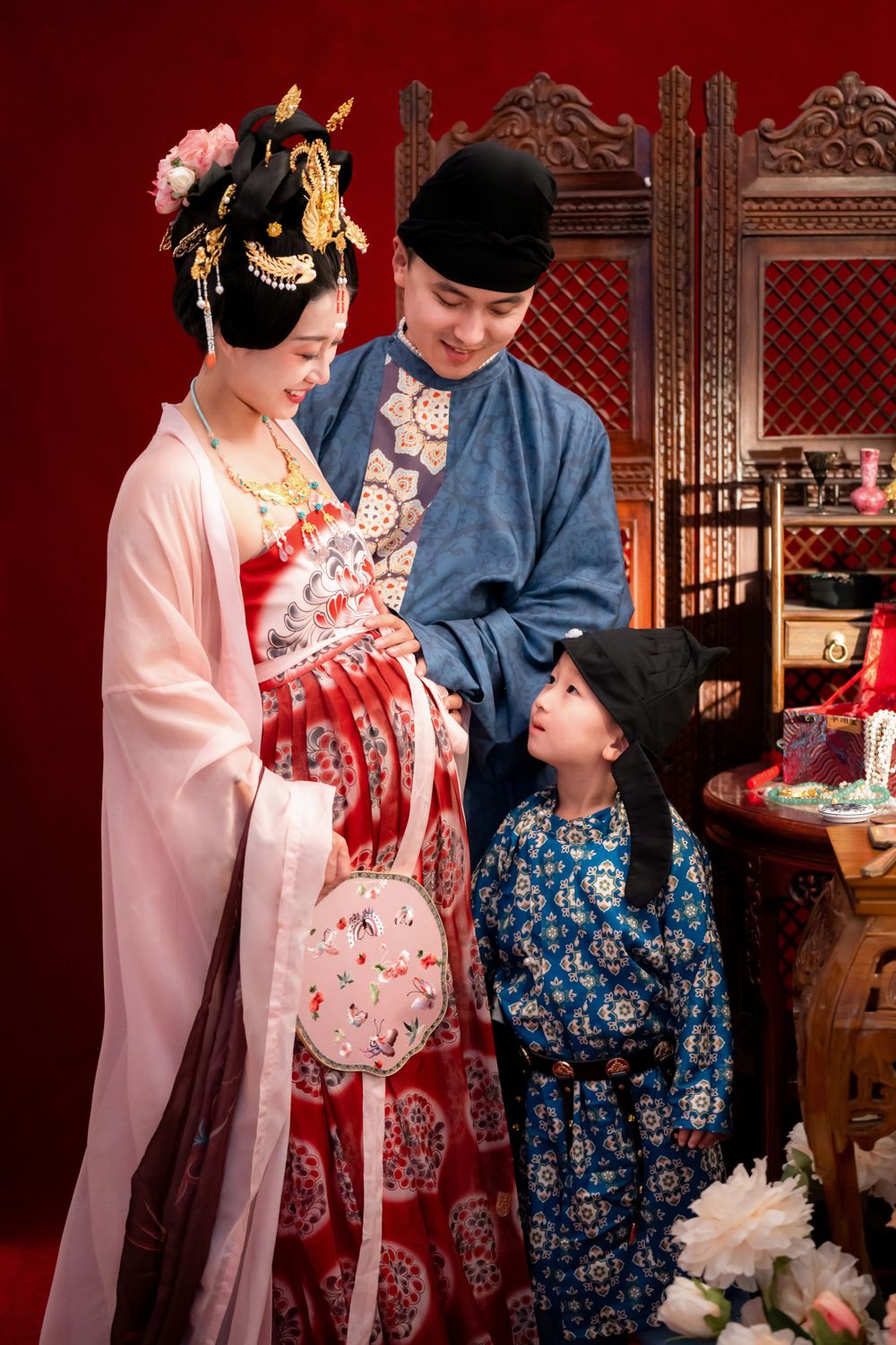 Cinematic Tang Dynasty Hanfu maternity and family studio portrait with dramatic lighting, by Imagine Image Studio Auckland.