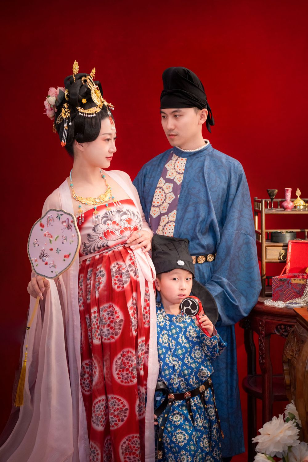 Cinematic Tang Dynasty Hanfu maternity and family studio portrait with dramatic lighting, by Imagine Image Studio Auckland.