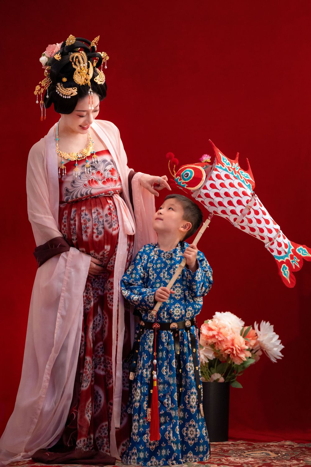 Cinematic Tang Dynasty Hanfu maternity and family studio portrait with dramatic lighting, by Imagine Image Studio Auckland.