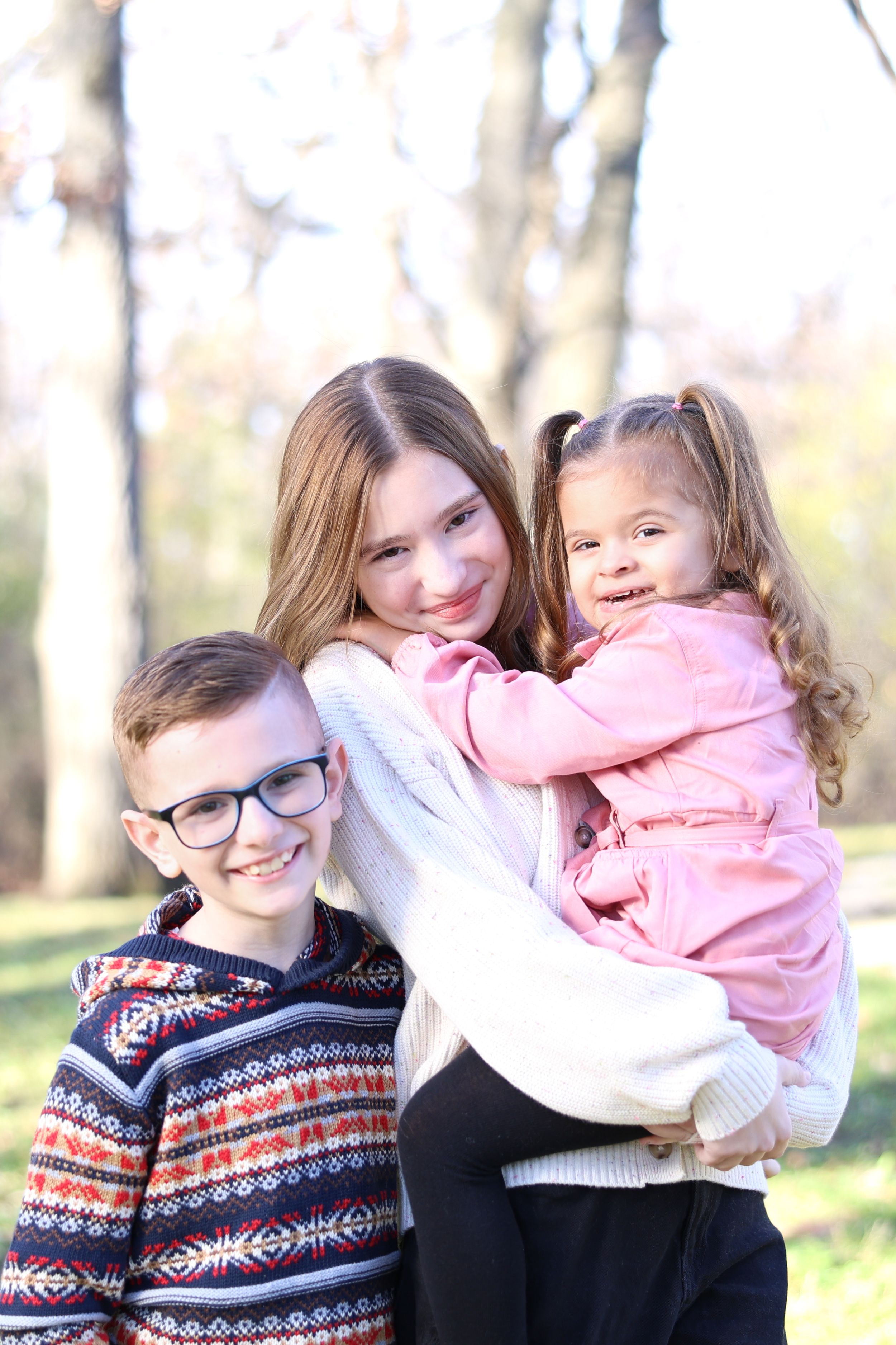 Family portrait series showing tender moments between parent and child outdoors in winter clothing.
