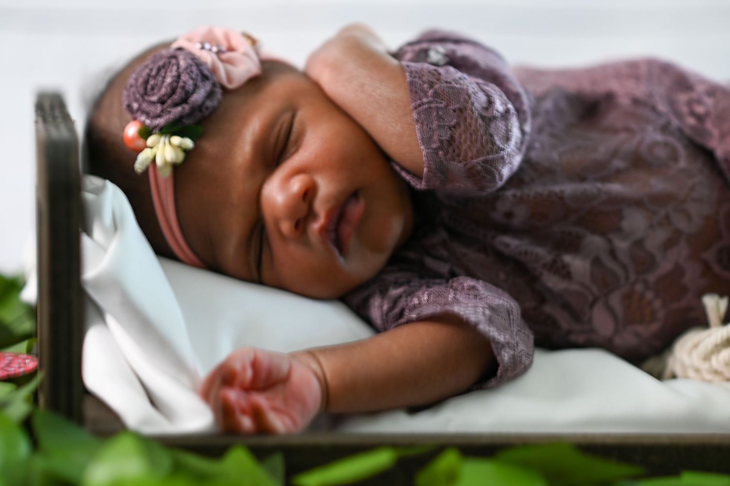 baby holding her face