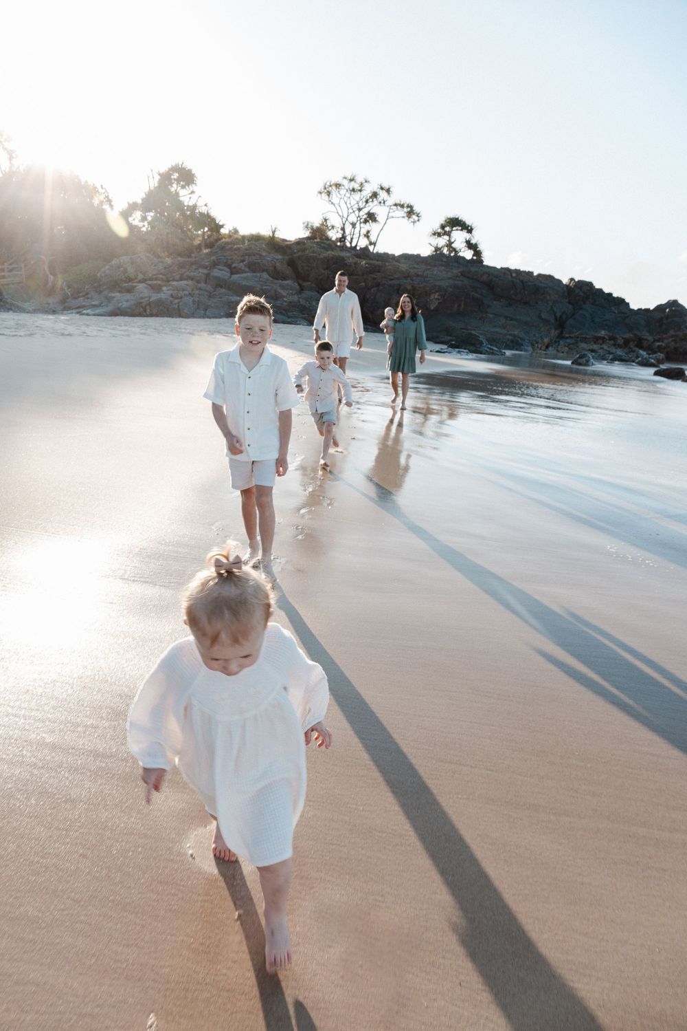 Family photos at Cabarita Headland during golden hour with ocean views in Northern NSW