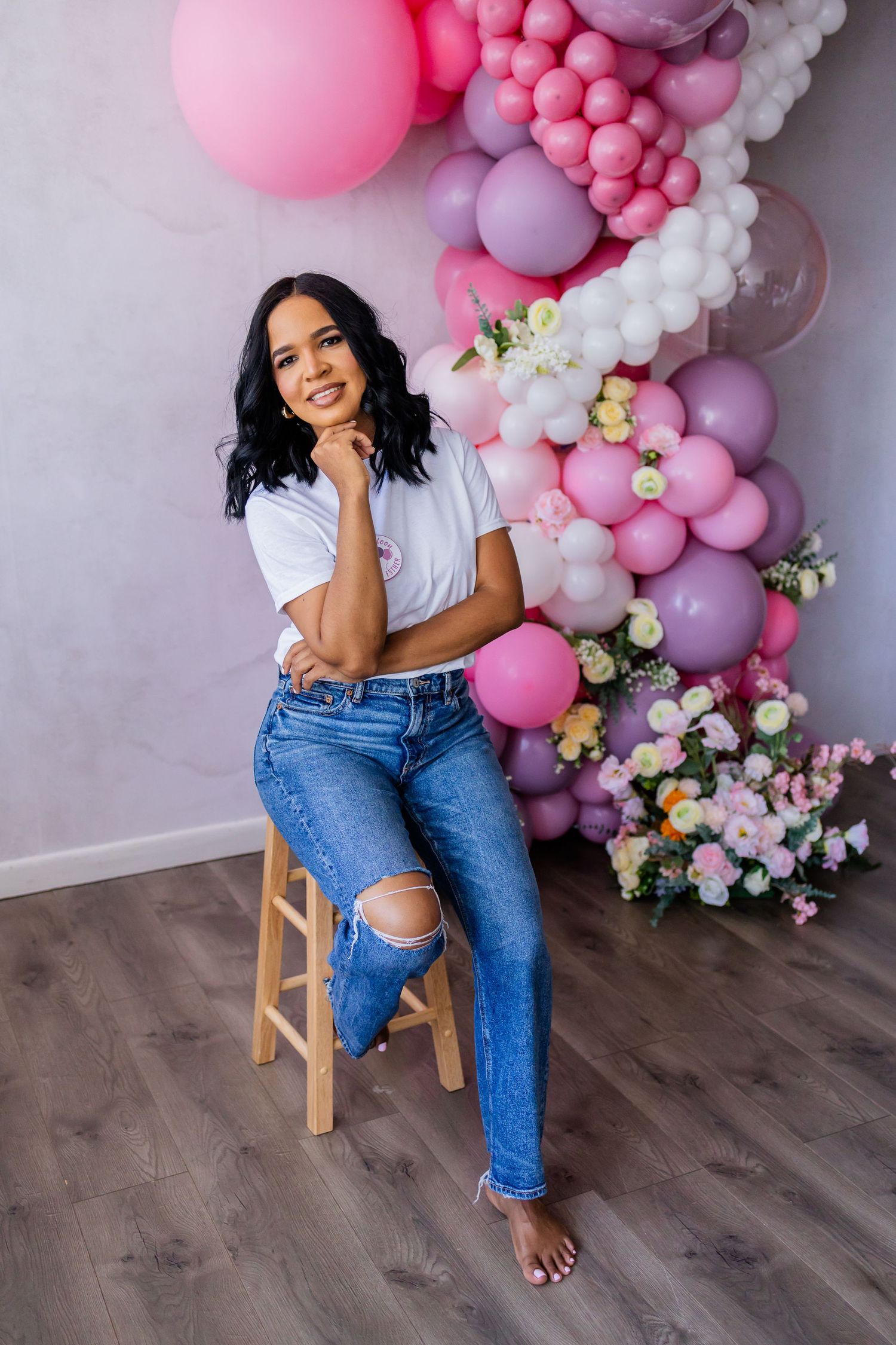 studio branding session woman sitting, balloon work.