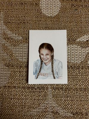A series of vintage-style sepia photographs arranged in a row on a textured burlap background.