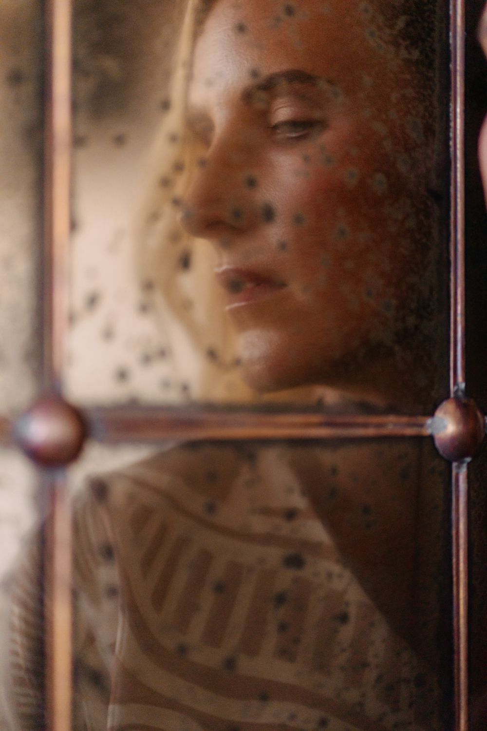 Woman behind glass in Mallorca, Spain