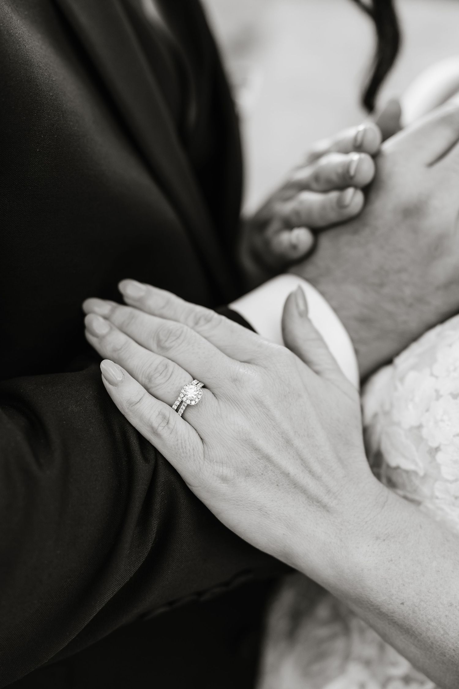 Close-up black and white photos showing wedding rings and clasped hands in sequence.