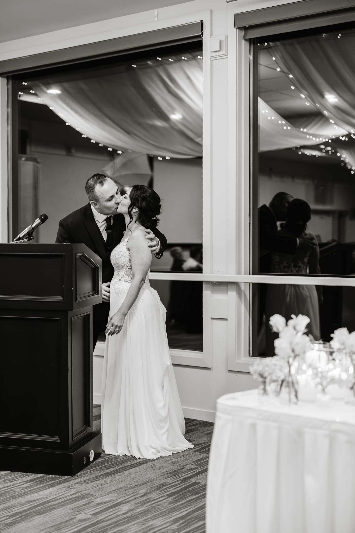 A romantic black and white photo sequence shows a couple sharing their first dance at a wedding reception.