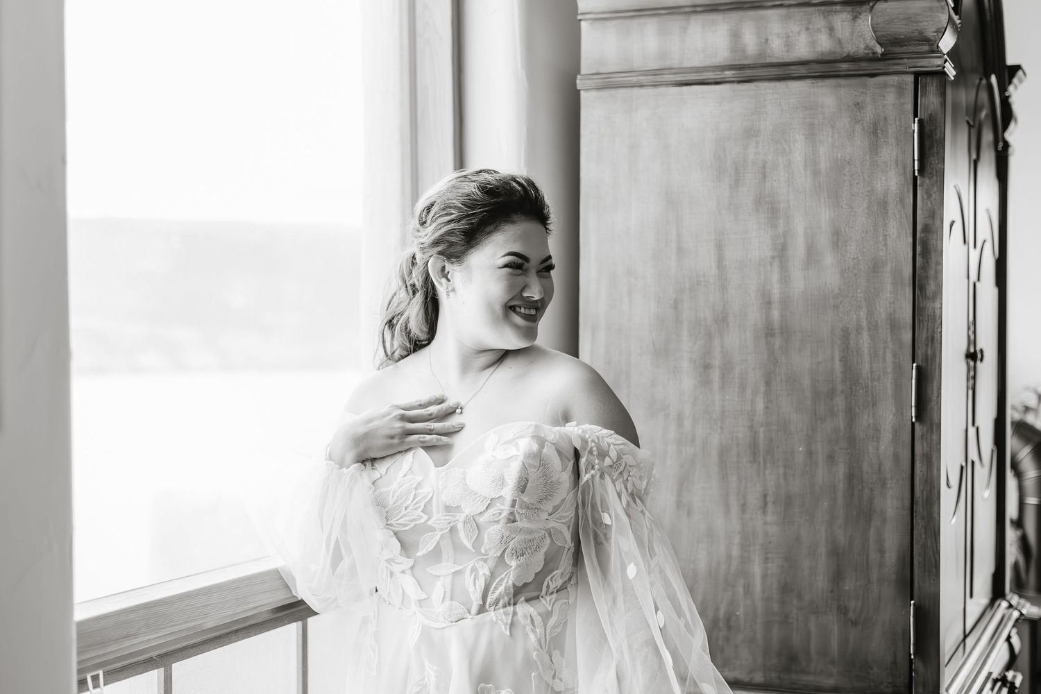 Black and white photo series showing a bride getting ready for her wedding day in a classic vintage style.