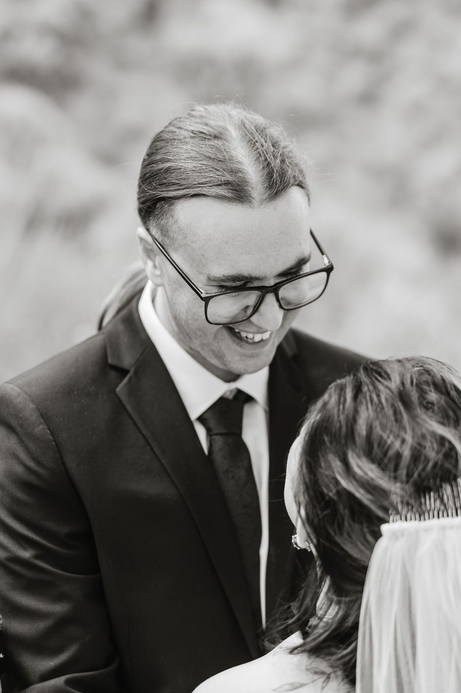Black and white intimate wedding moment captured in a series of candid shots.