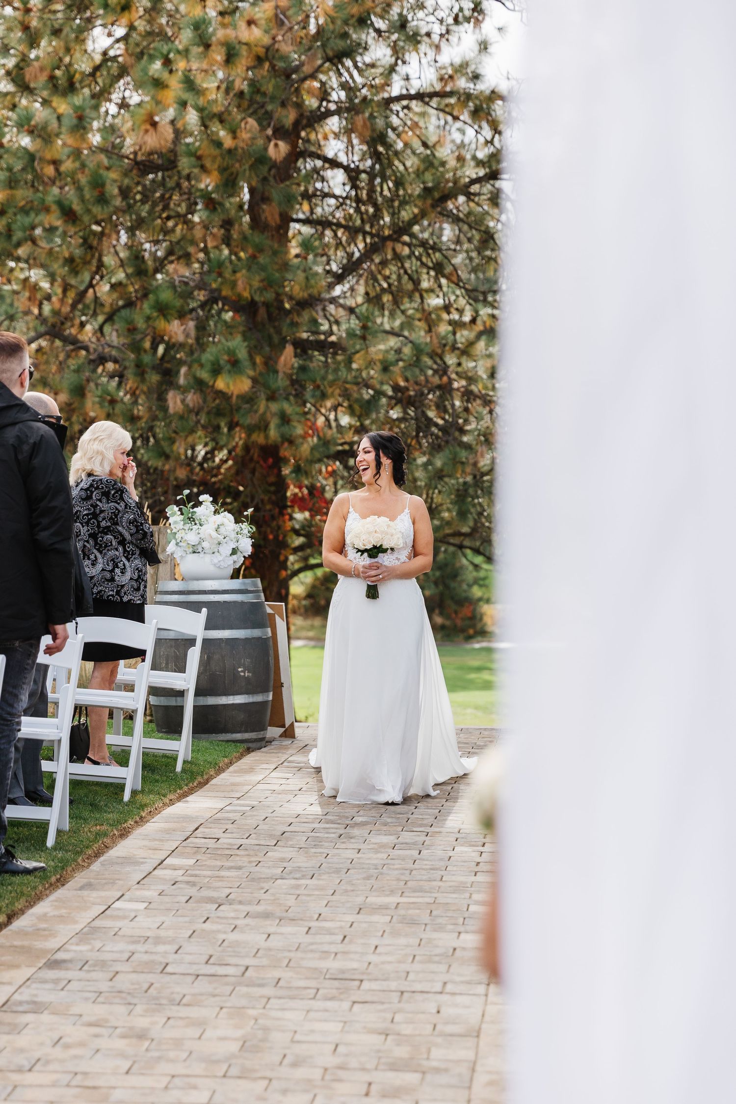 A sequence of wedding ceremony moments captured on a stone pathway surrounded by autumn trees.