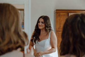 An elegant wedding preparation scene in a bright interior room.